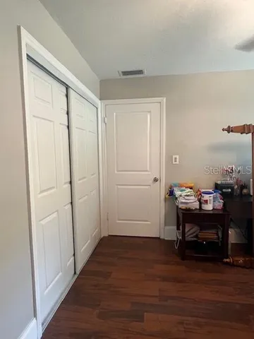 a view of a workspace with wooden floor