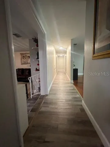 a view of a hallway with the wooden floor