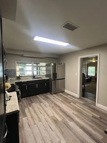 a kitchen with granite countertop lots of counter top space
