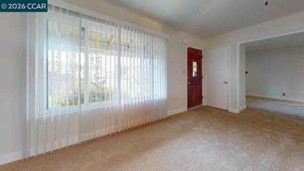 a view of an empty room with a window
