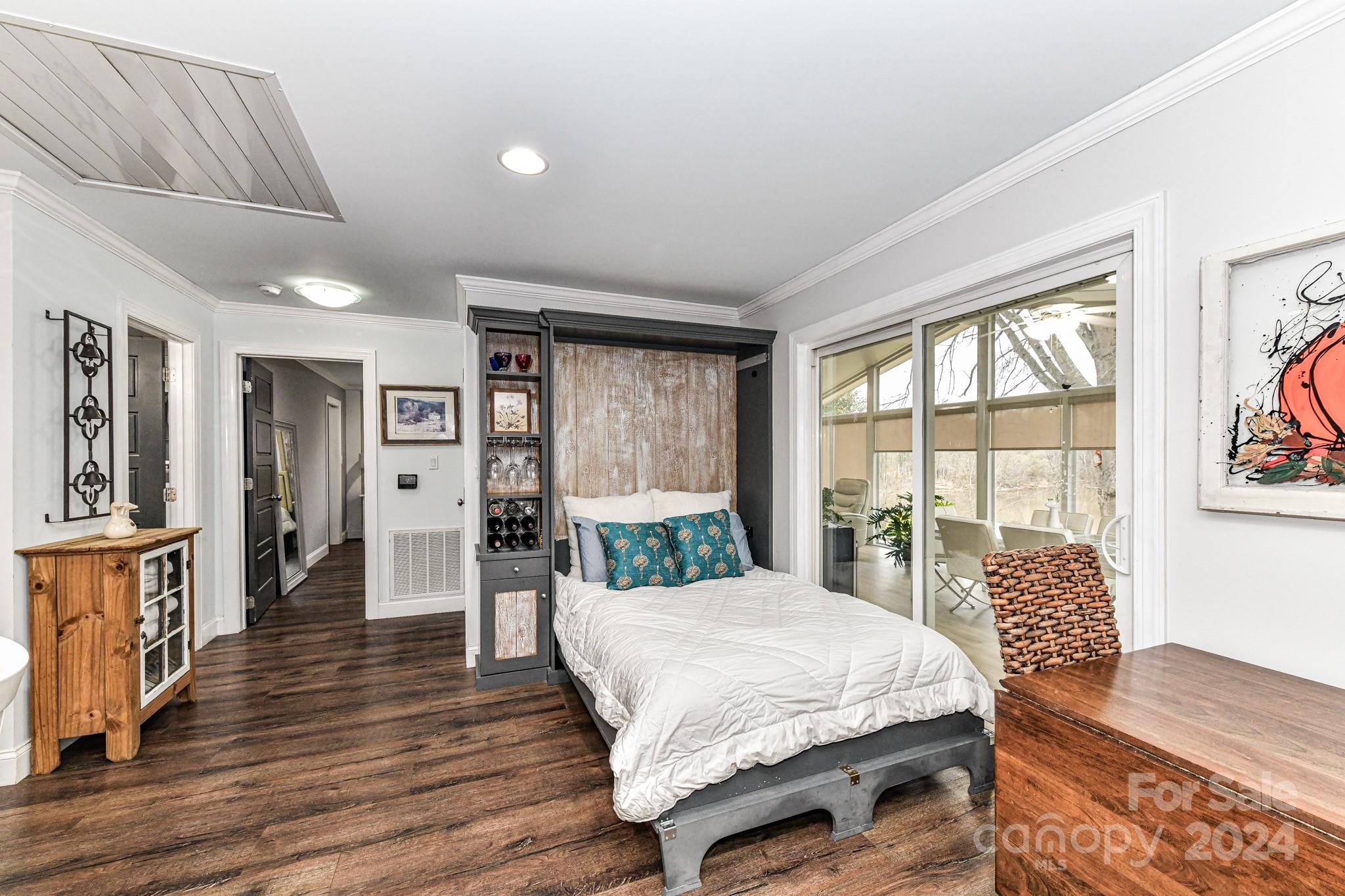 334 Ervin Road Mooresville, NC 28117 - Photo 14 of 48 a spacious bedroom with a large bed and a large window