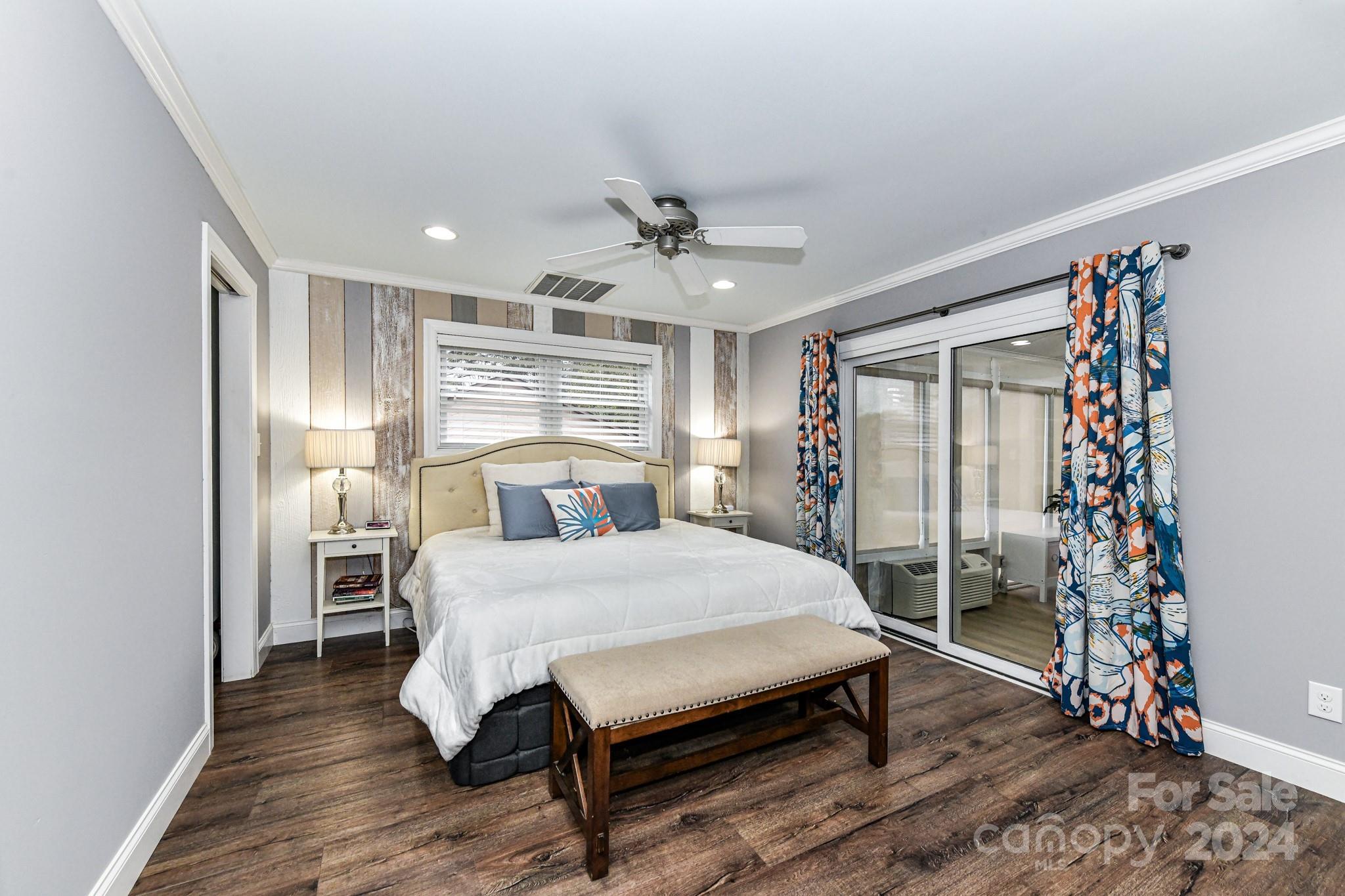 334 Ervin Road Mooresville, NC 28117 - Photo 17 of 48 a bedroom with a bed and a chandelier