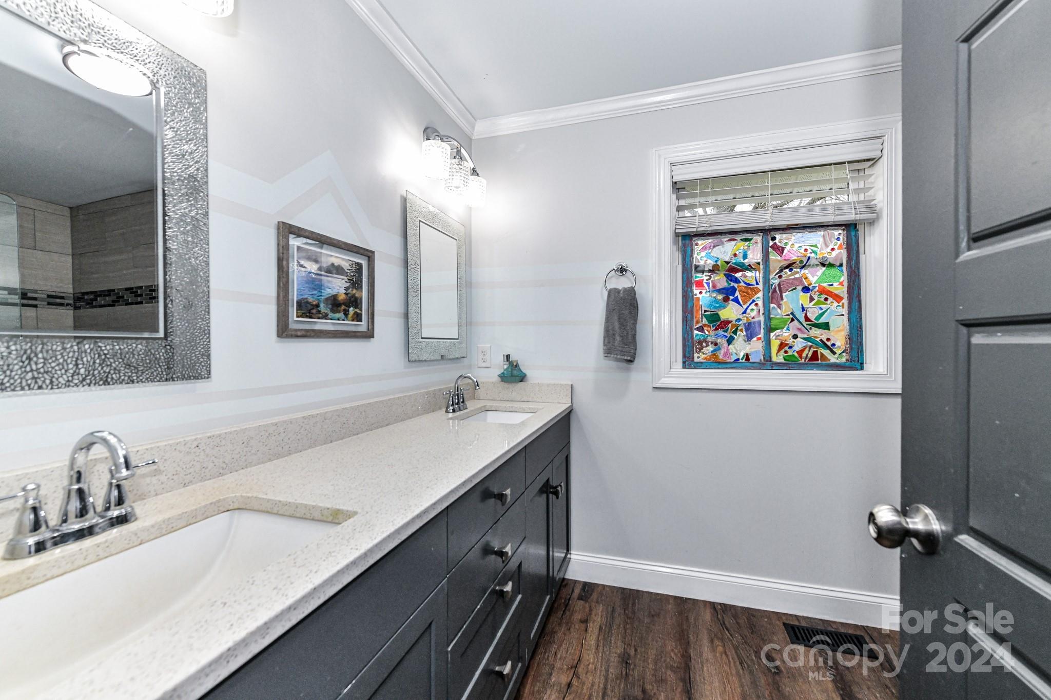 334 Ervin Road Mooresville, NC 28117 - Photo 19 of 48 a bathroom with a sink a vanity and a mirror
