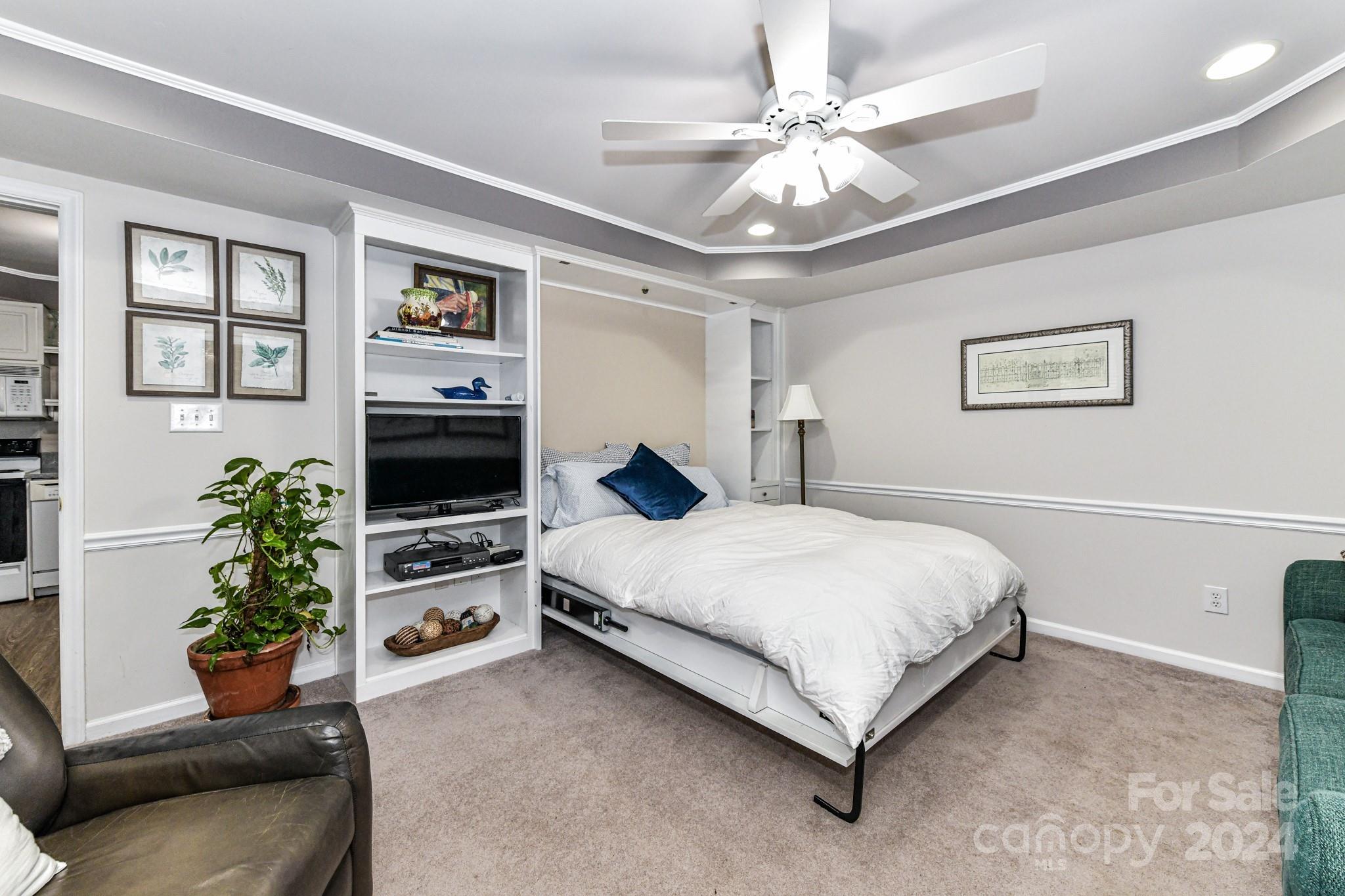 334 Ervin Road Mooresville, NC 28117 - Photo 24 of 48 a spacious bedroom with a bed and a couch