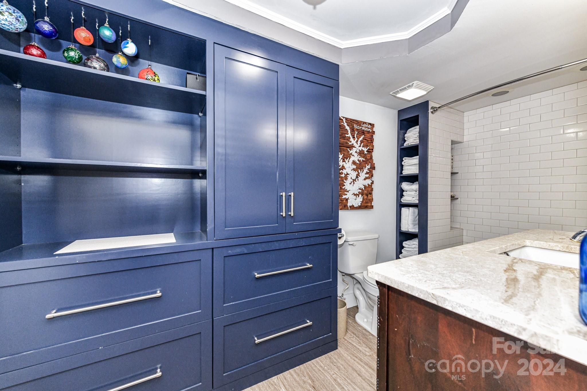 334 Ervin Road Mooresville, NC 28117 - Photo 26 of 48 a kitchen with a refrigerator and cabinets