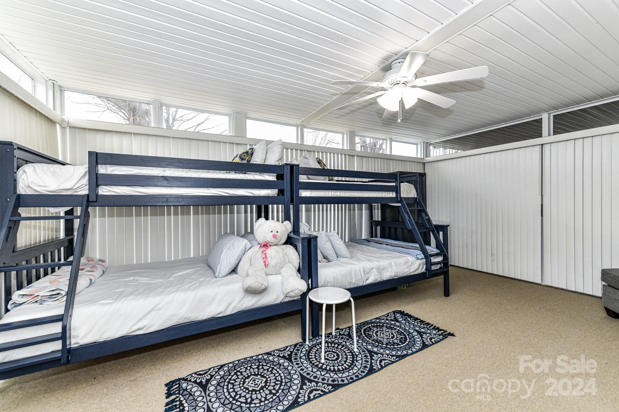 334 Ervin Road Mooresville, NC 28117 - Photo 31 of 48 a bedroom with furniture and a chandelier