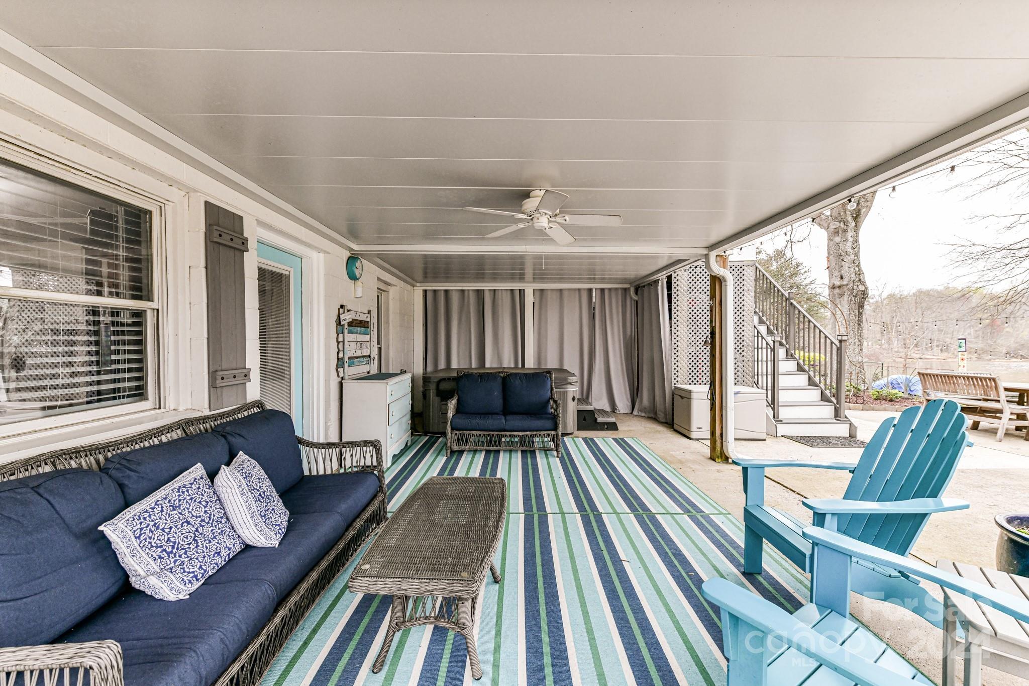 334 Ervin Road Mooresville, NC 28117 - Photo 35 of 48 a view of living room with furniture and floor to ceiling windows