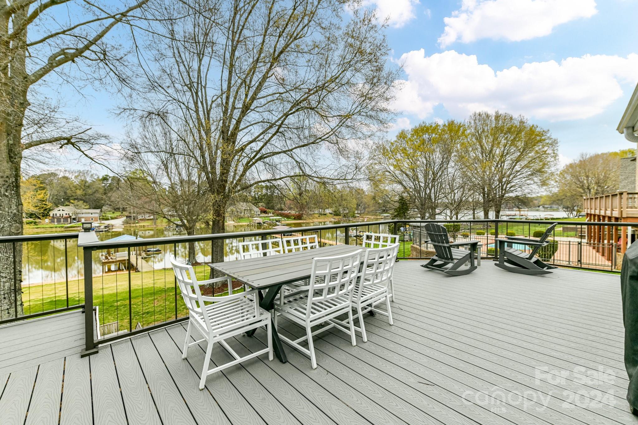 334 Ervin Road Mooresville, NC 28117 - Photo 36 of 48 a view of a balcony with chairs and wooden floor