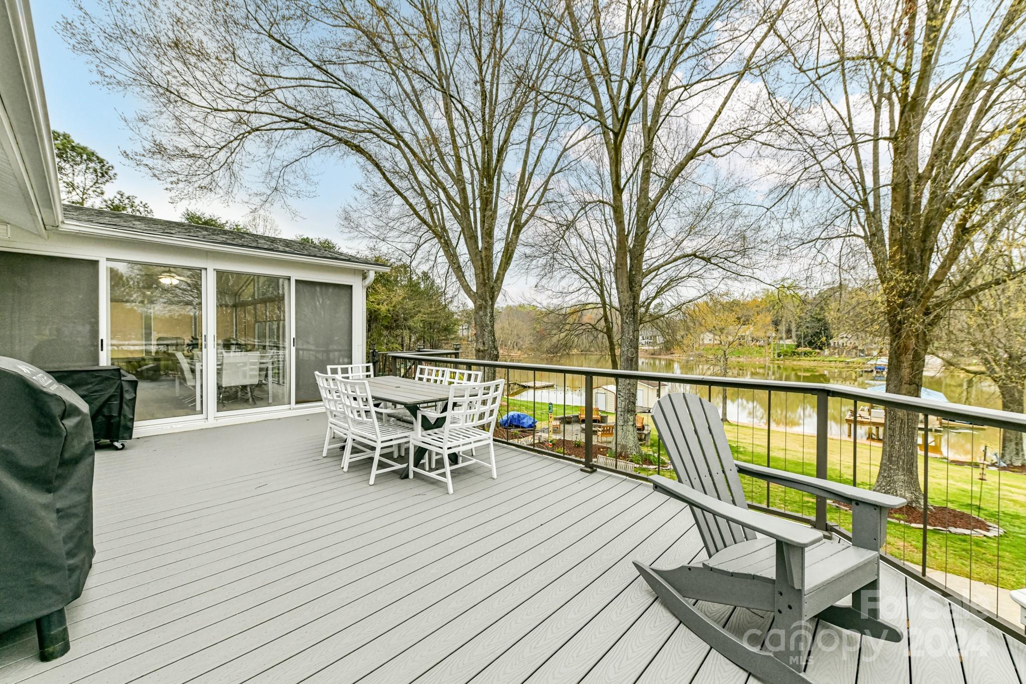 334 Ervin Road Mooresville, NC 28117 - Photo 37 of 48 a roof deck with table and chairs and wooden floor