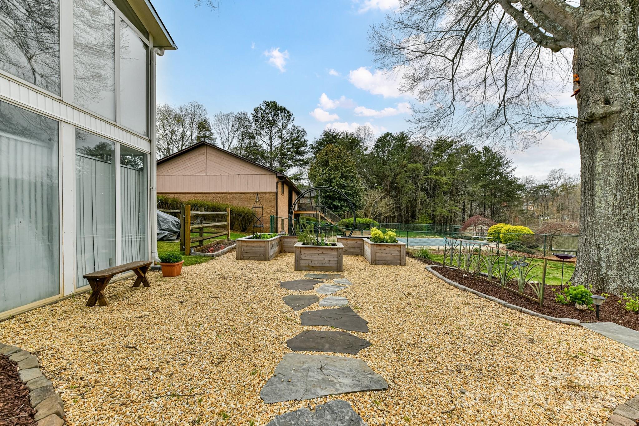 334 Ervin Road Mooresville, NC 28117 - Photo 41 of 48 a view of a house with backyard porch and sitting area