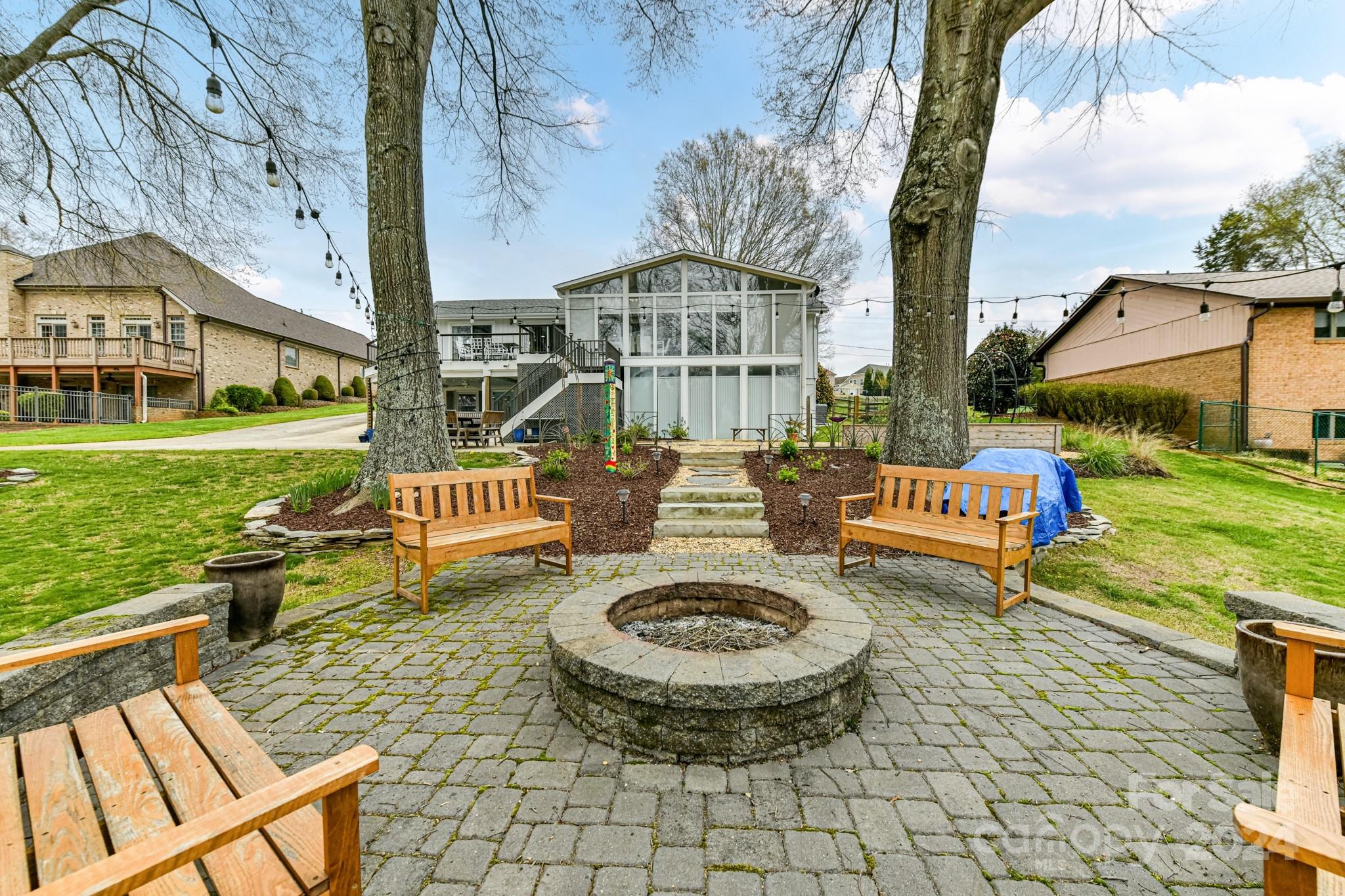 334 Ervin Road Mooresville, NC 28117 - Photo 43 of 48 a view of a chairs and table in backyard of the house