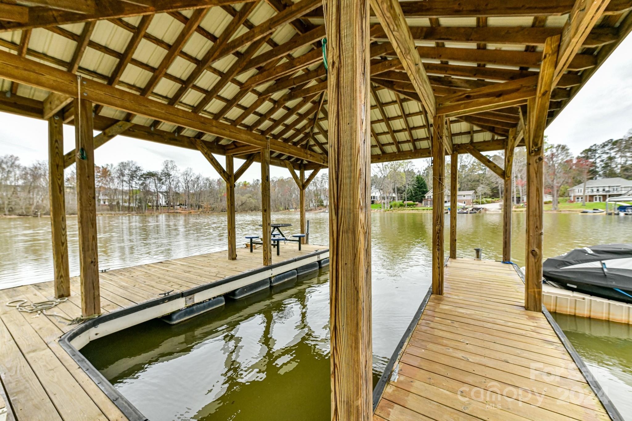 334 Ervin Road Mooresville, NC 28117 - Photo 46 of 48 a view of swimming pool with large windows and table