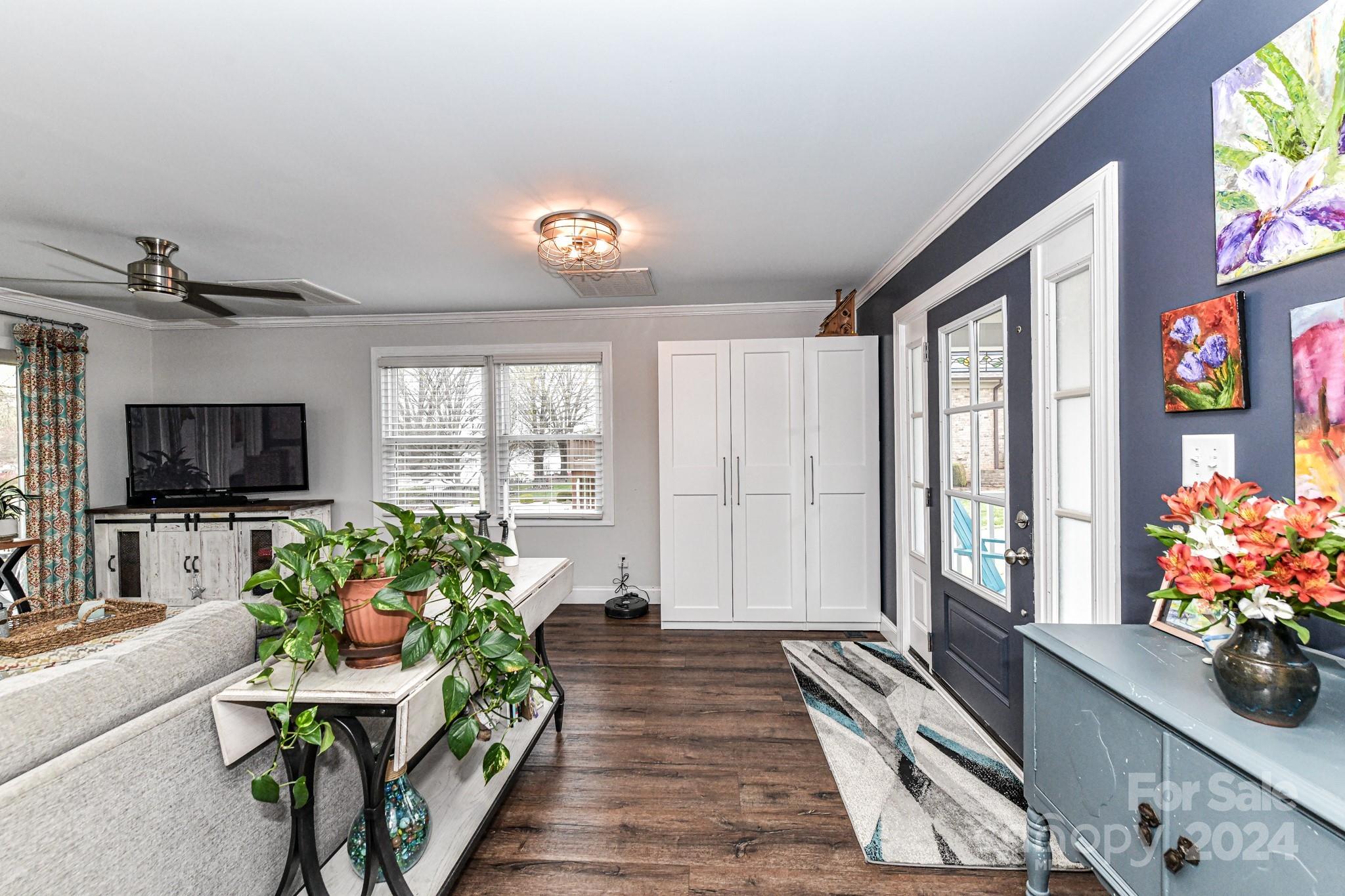 334 Ervin Road Mooresville, NC 28117 - Photo 5 of 48 a living room with furniture and a flat screen tv