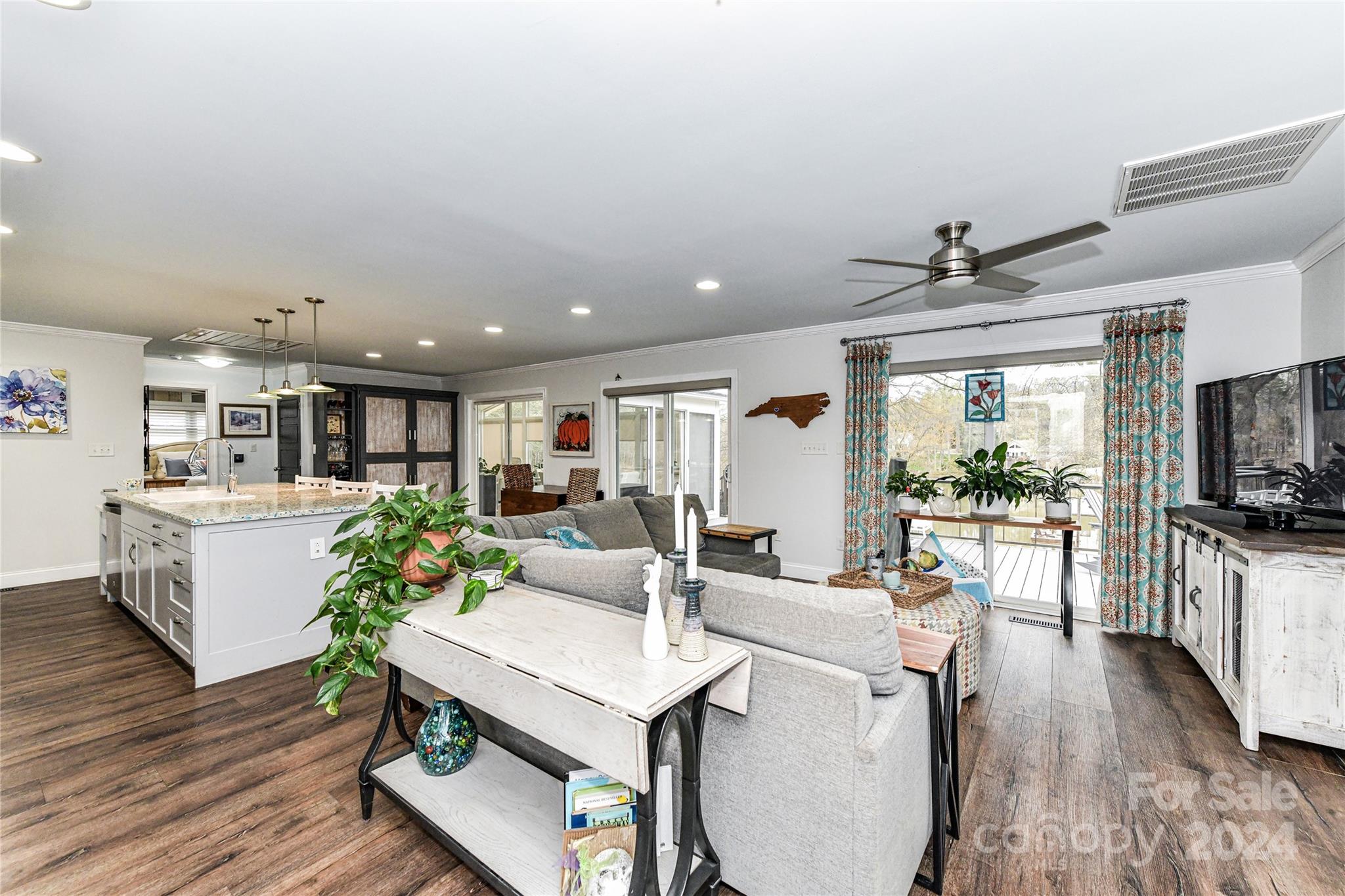 334 Ervin Road Mooresville, NC 28117 - Photo 6 of 48 a living room with furniture a flat screen tv and a large window