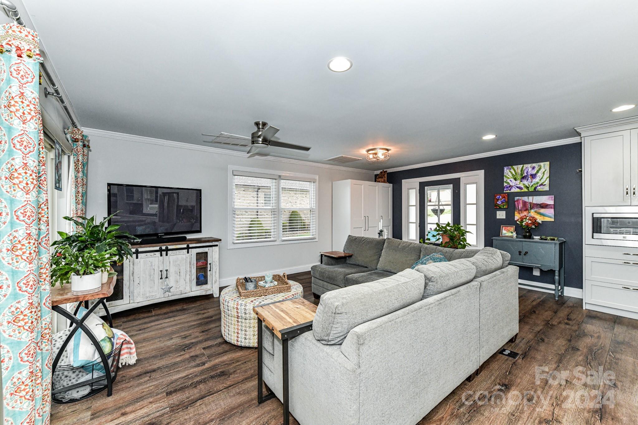 334 Ervin Road Mooresville, NC 28117 - Photo 7 of 48 a living room with furniture and a flat screen tv