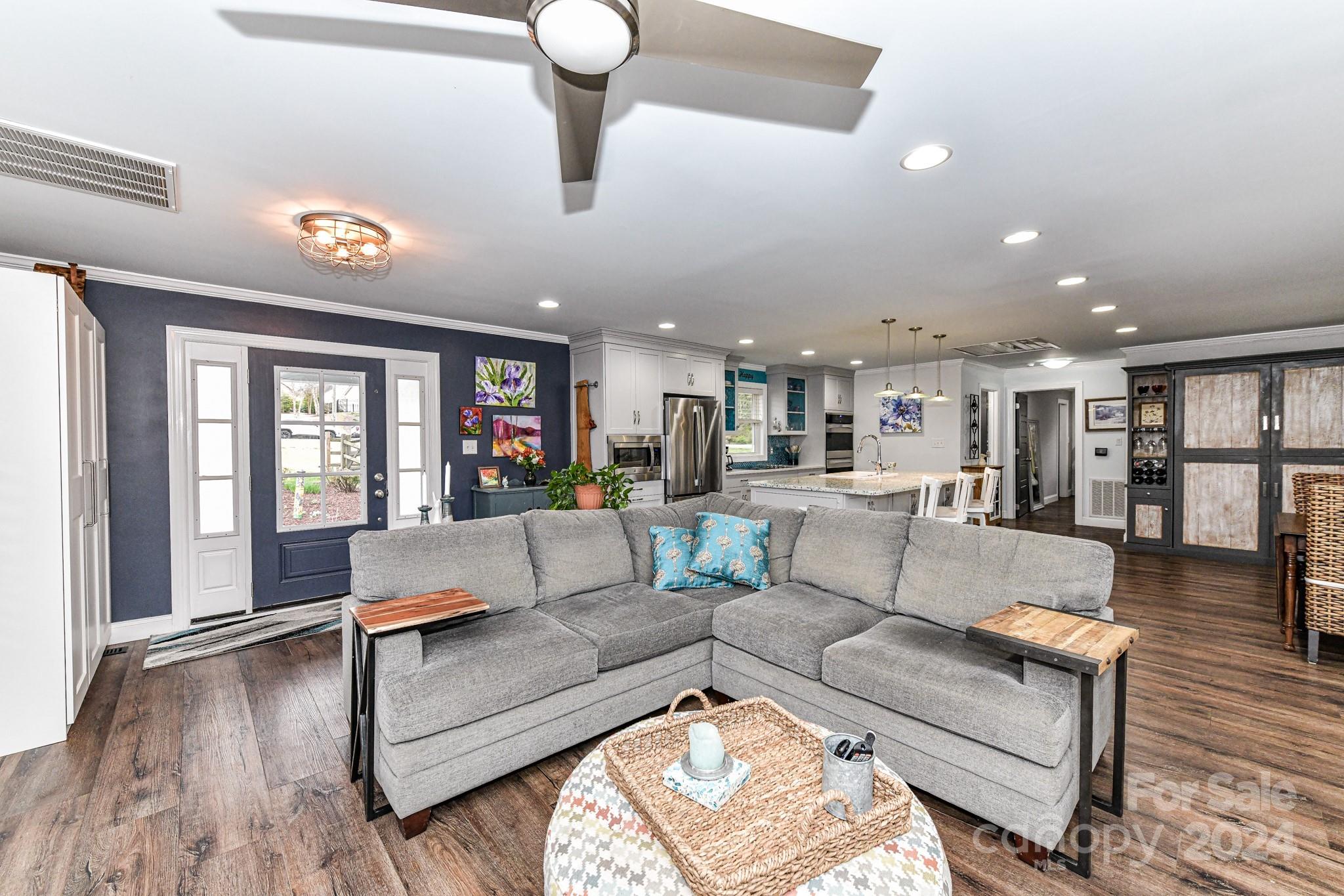 334 Ervin Road Mooresville, NC 28117 - Photo 8 of 48 a living room with furniture and a wooden floor