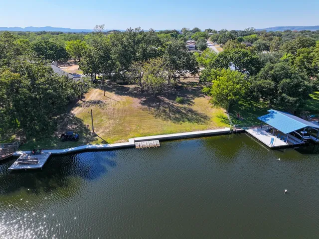 an aerial view of a house with a lake view