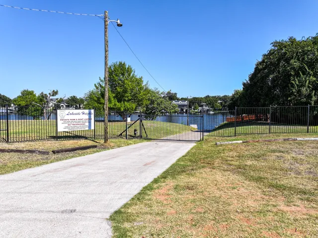 an aerial view of a house with a lake view