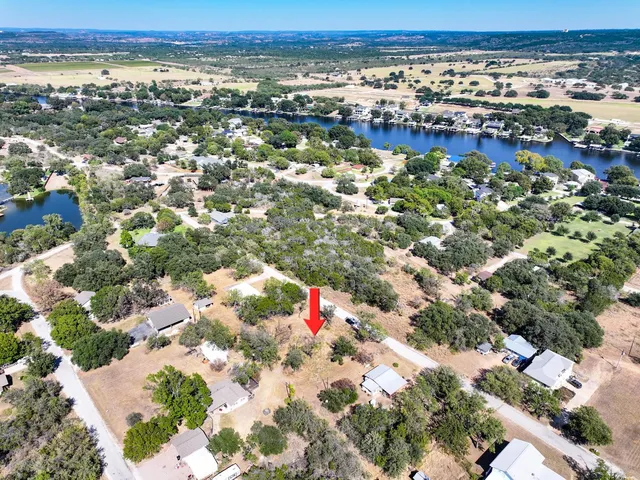 an aerial view of residential building and lake