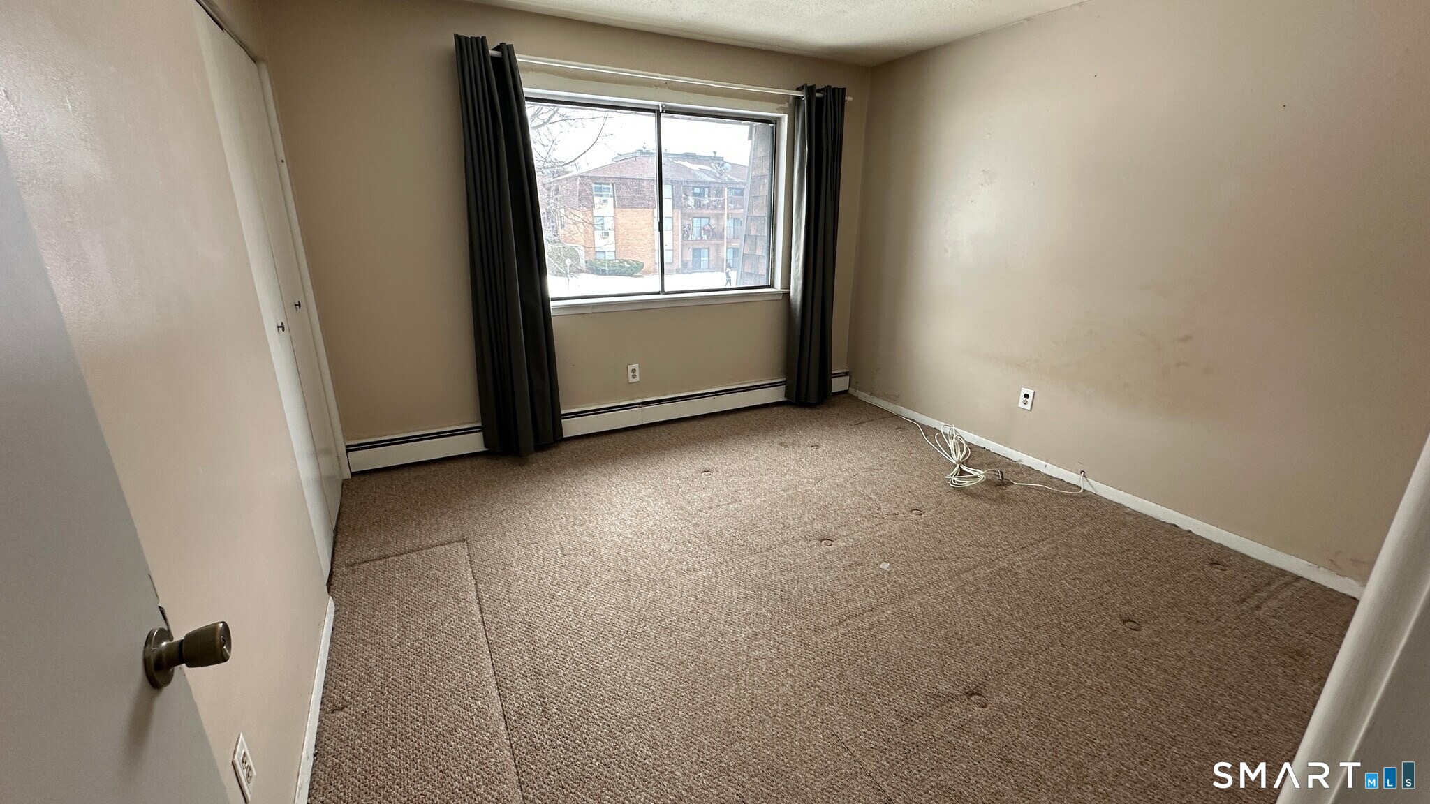 581 Crown Street, Unit 99 Meriden, CT 06450 - Photo 4 of 10 an empty room with windows