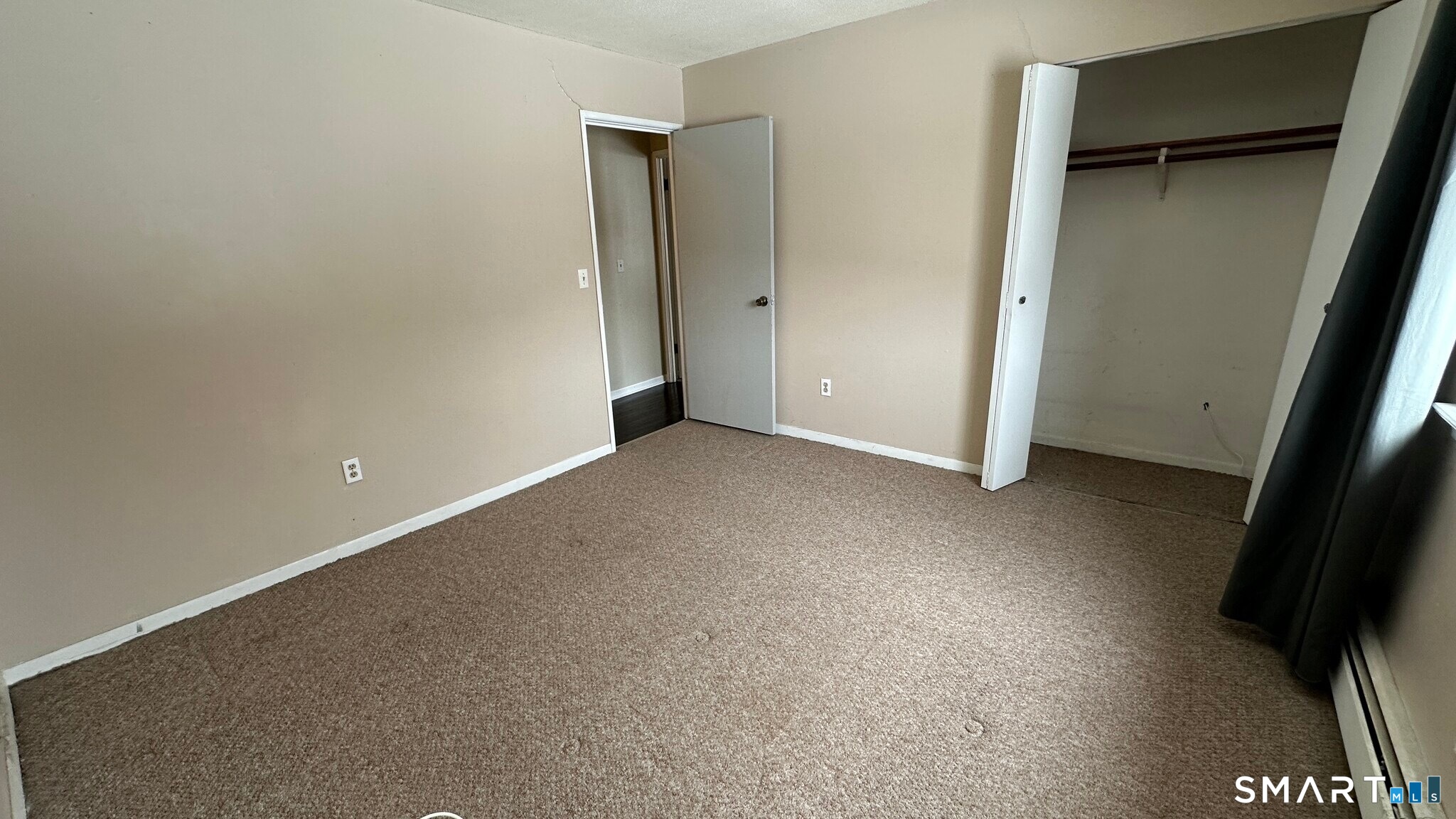 581 Crown Street, Unit 99 Meriden, CT 06450 - Photo 5 of 10 an empty room with windows