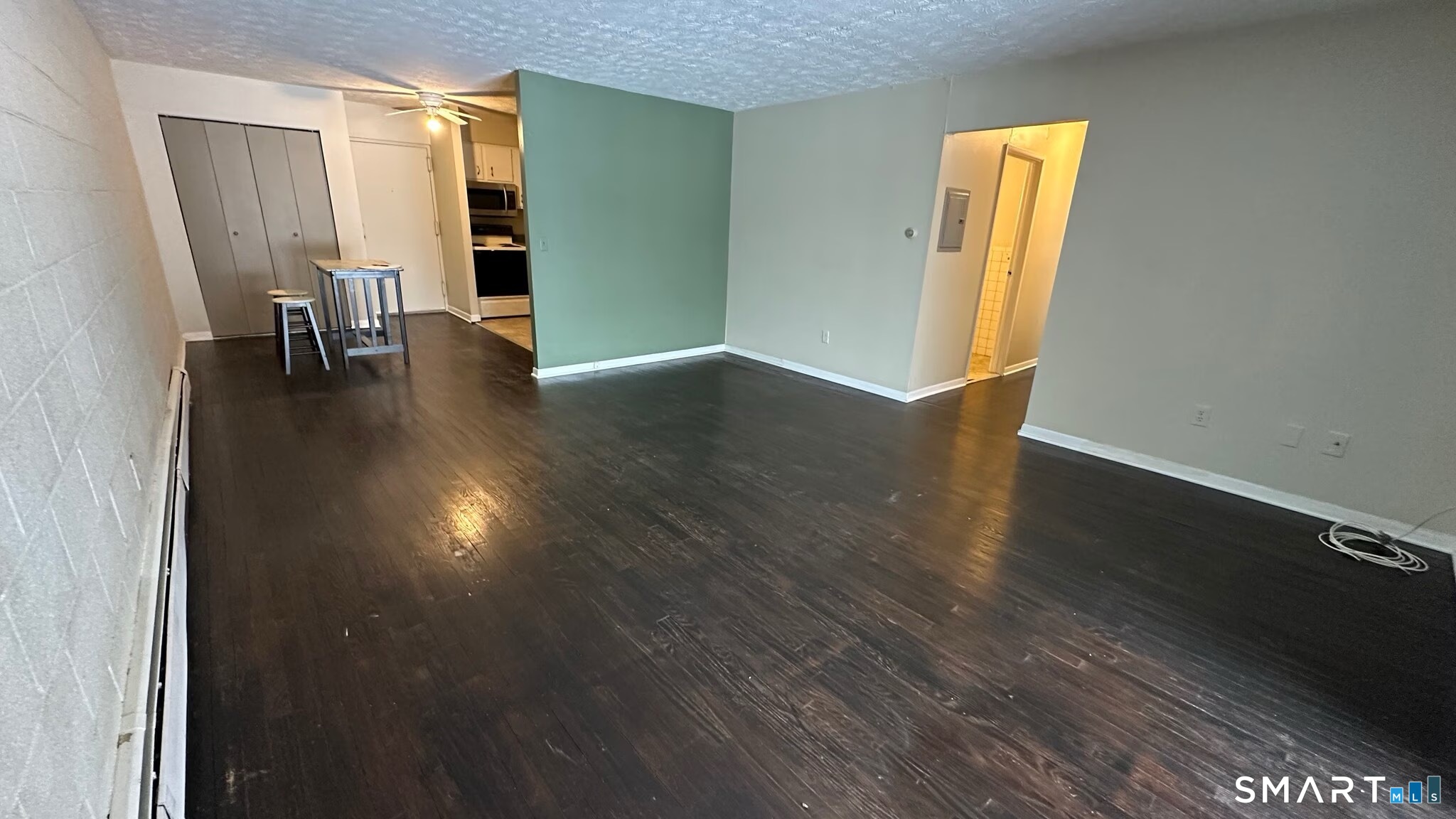 581 Crown Street, Unit 99 Meriden, CT 06450 - Photo 9 of 10 a view of empty room with wooden floor