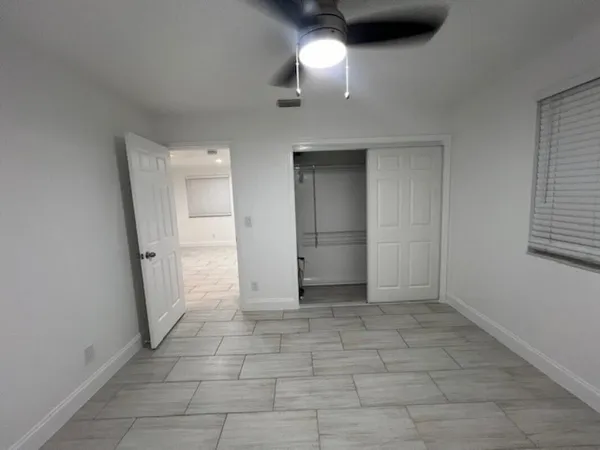 an empty room with a bathroom