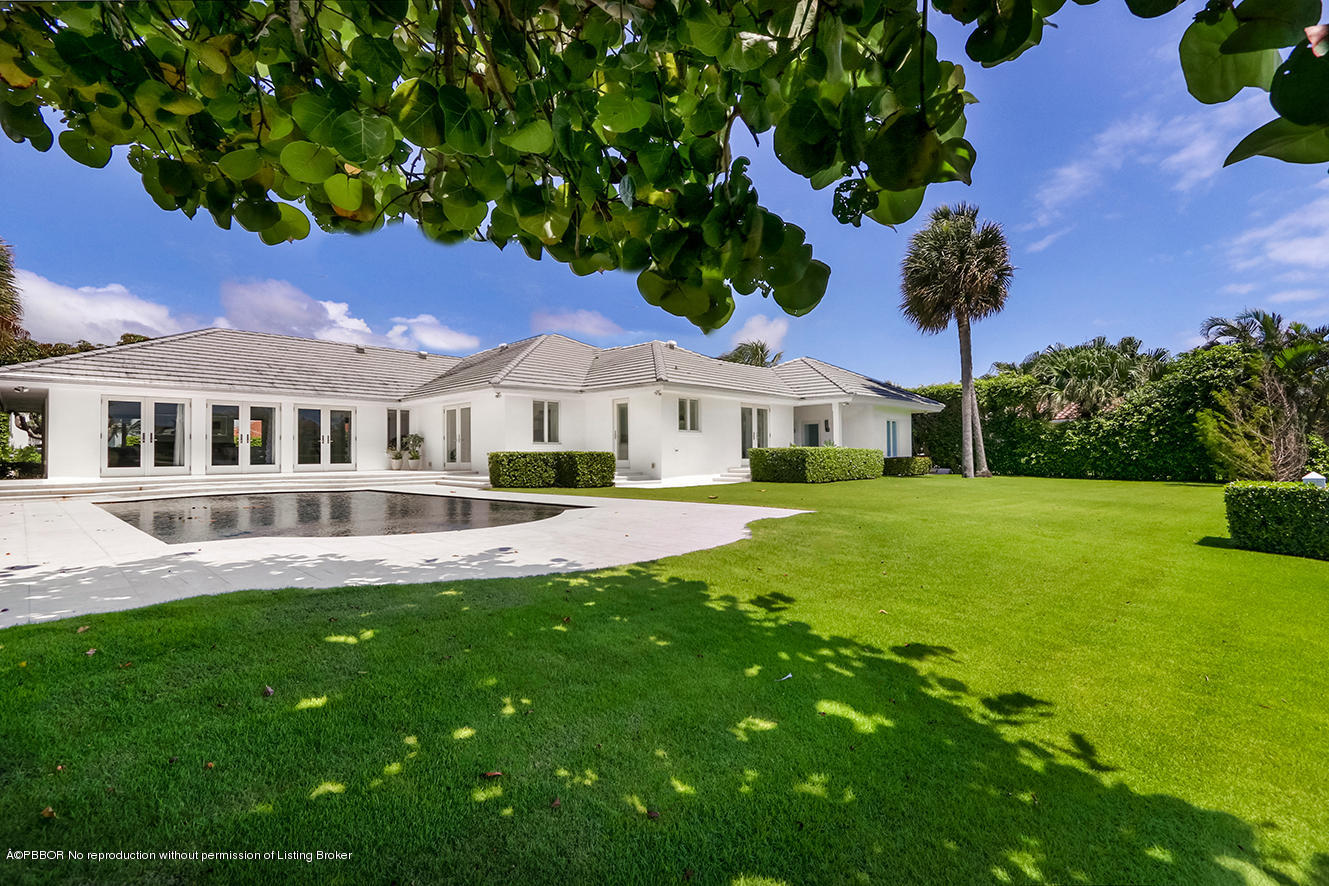 75 Spoonbill Road Manalapan, FL 33462 - Photo 25 of 41 a view of house with a garden