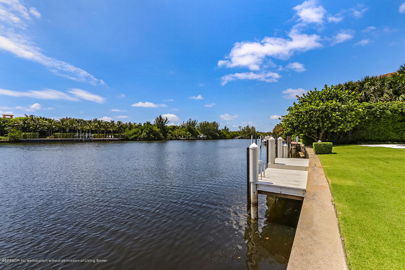 75 Spoonbill Road Manalapan, FL 33462 - Photo 26 of 41 a view of a lake with houses in the background