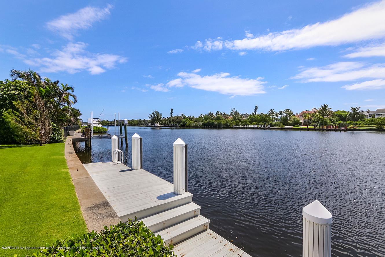 75 Spoonbill Road Manalapan, FL 33462 - Photo 27 of 41 a view of a lake with houses in back
