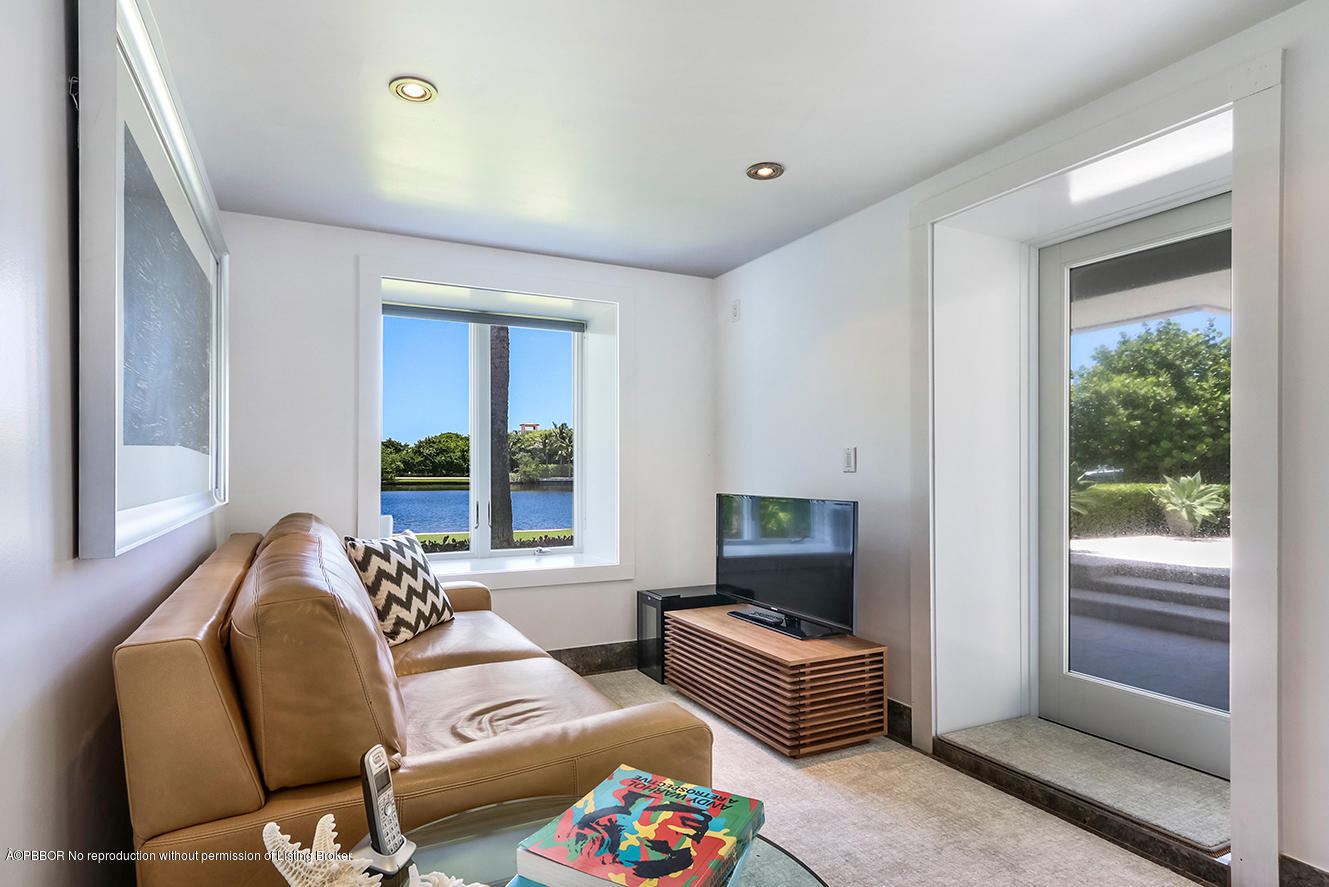 75 Spoonbill Road Manalapan, FL 33462 - Photo 29 of 41 a bedroom with furniture and a window