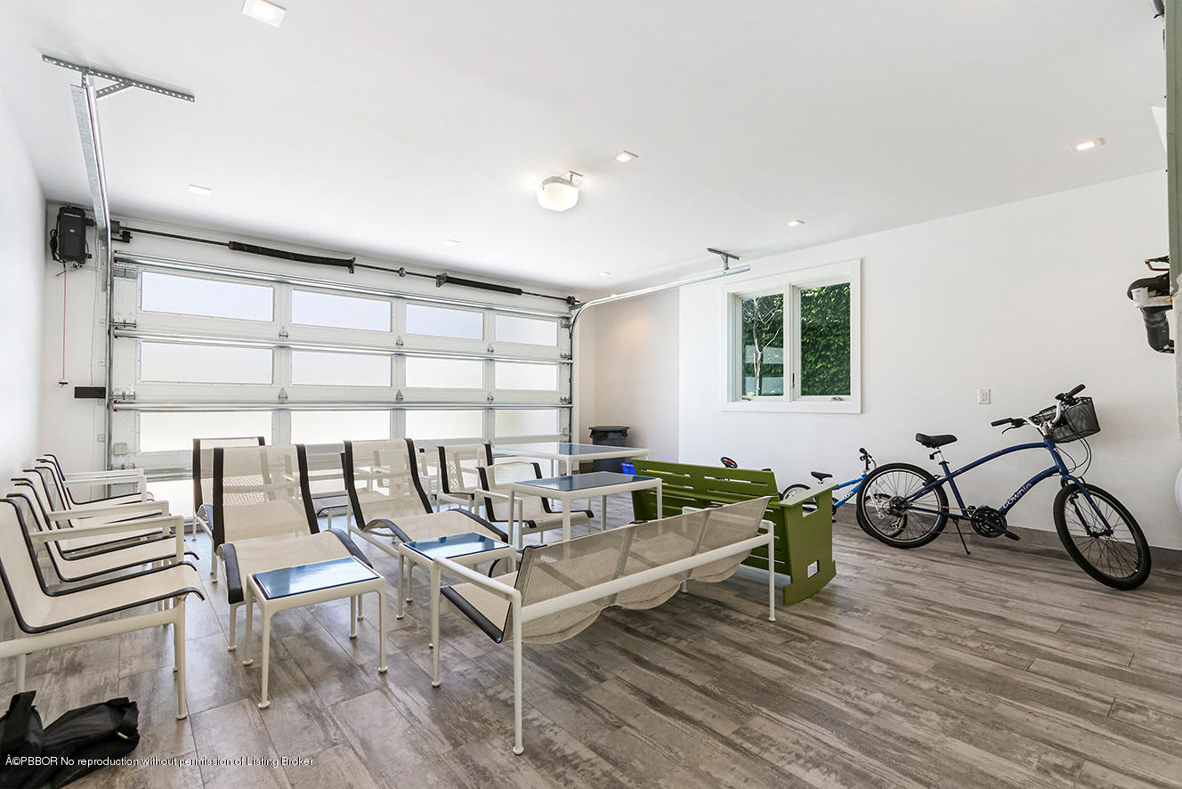 75 Spoonbill Road Manalapan, FL 33462 - Photo 30 of 41 a living room with furniture and a window