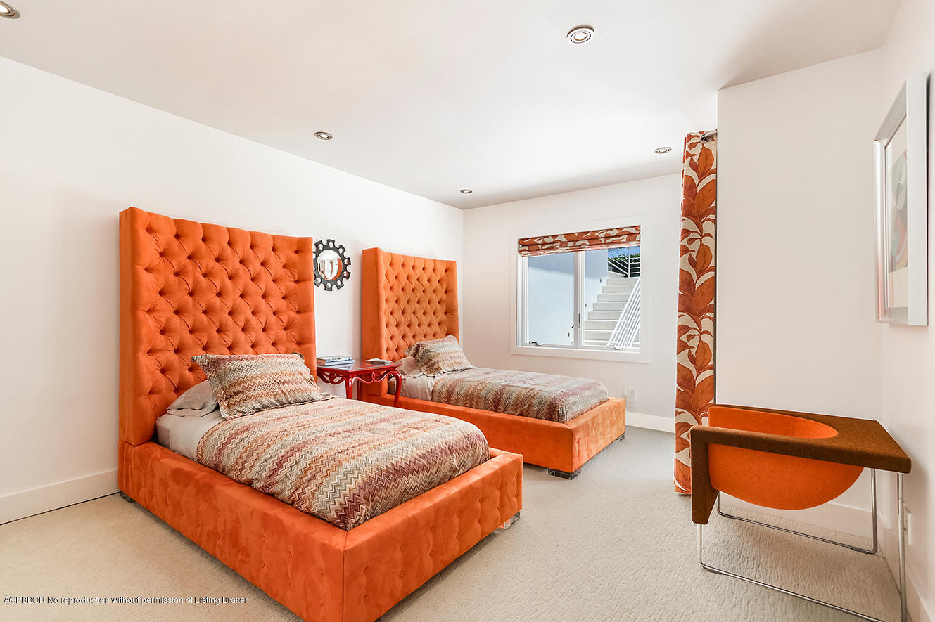75 Spoonbill Road Manalapan, FL 33462 - Photo 32 of 41 a bedroom with two beds and a large window