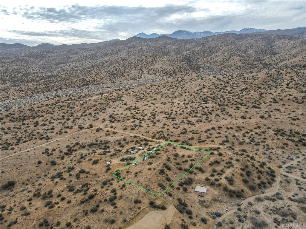 0 Apache Pass Pioneertown, CA 92268 - Photo 17 of 19 a view of a dry yard with mountains in the background