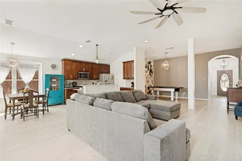 a kitchen with stainless steel appliances granite countertop a stove a refrigerator and a microwave