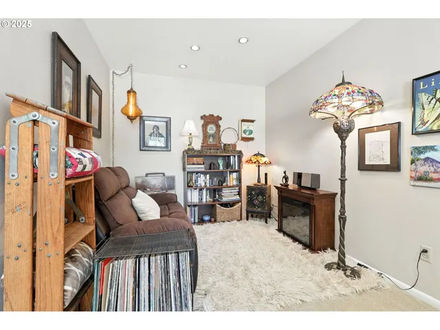 a bedroom with furniture and a wooden floor