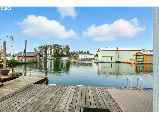 a balcony with furniture and wooden floor