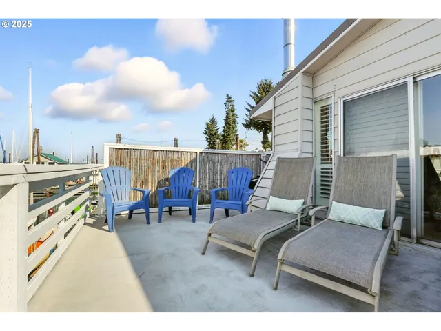 a aerial view of a house with a garden and lake view