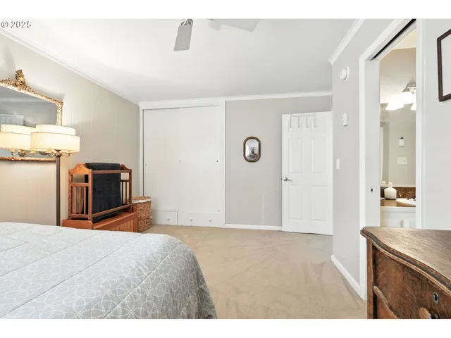 a bedroom with a bed and a television