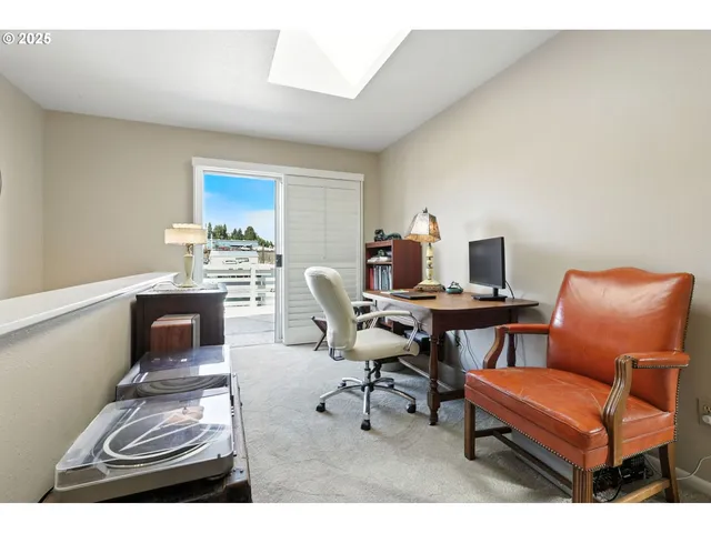 a workspace with furniture and a lamp