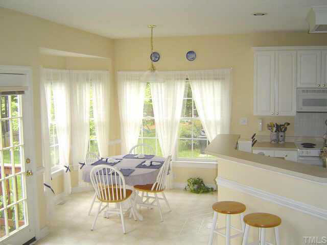 9016 Breeland Way Raleigh, NC 27613 - Photo 5 of 10 a living room with furniture and a large window