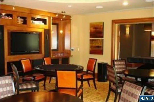 a view of a livingroom with furniture window and wooden floor