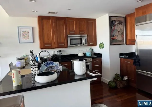 a kitchen with a sink and a stove top oven
