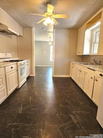 a large bathroom with a large mirror vanity and a shower