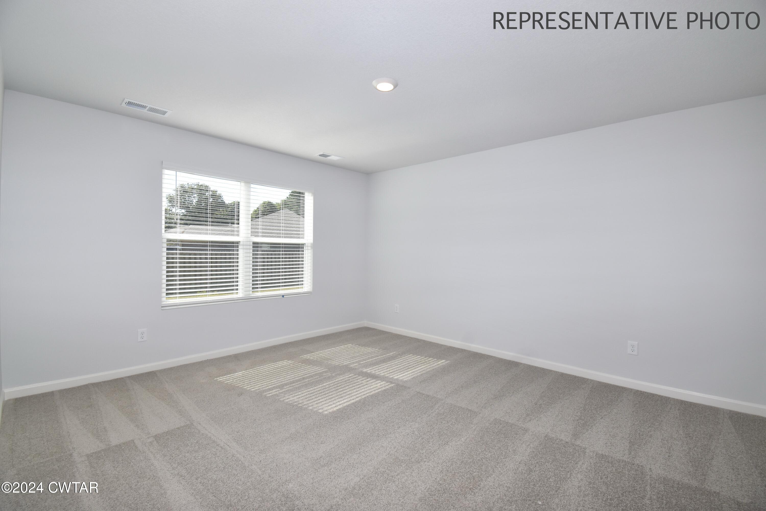 61 Vintage Grove Road Jackson, TN 38305 - Photo 15 of 25 an empty room with windows