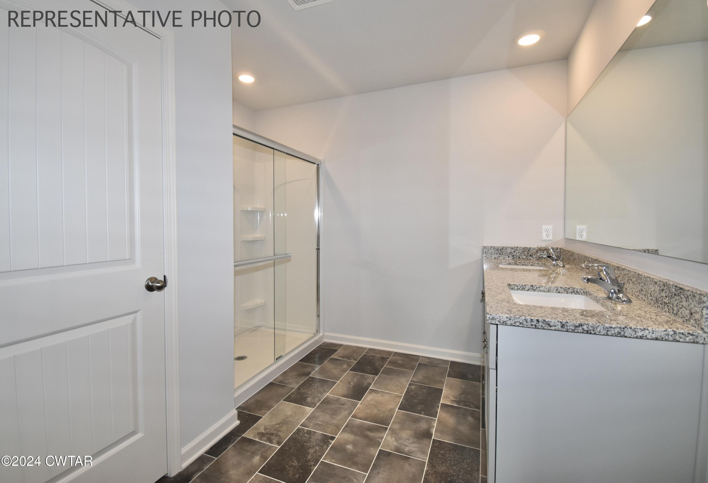 61 Vintage Grove Road Jackson, TN 38305 - Photo 17 of 25 a bathroom with a sink and a mirror