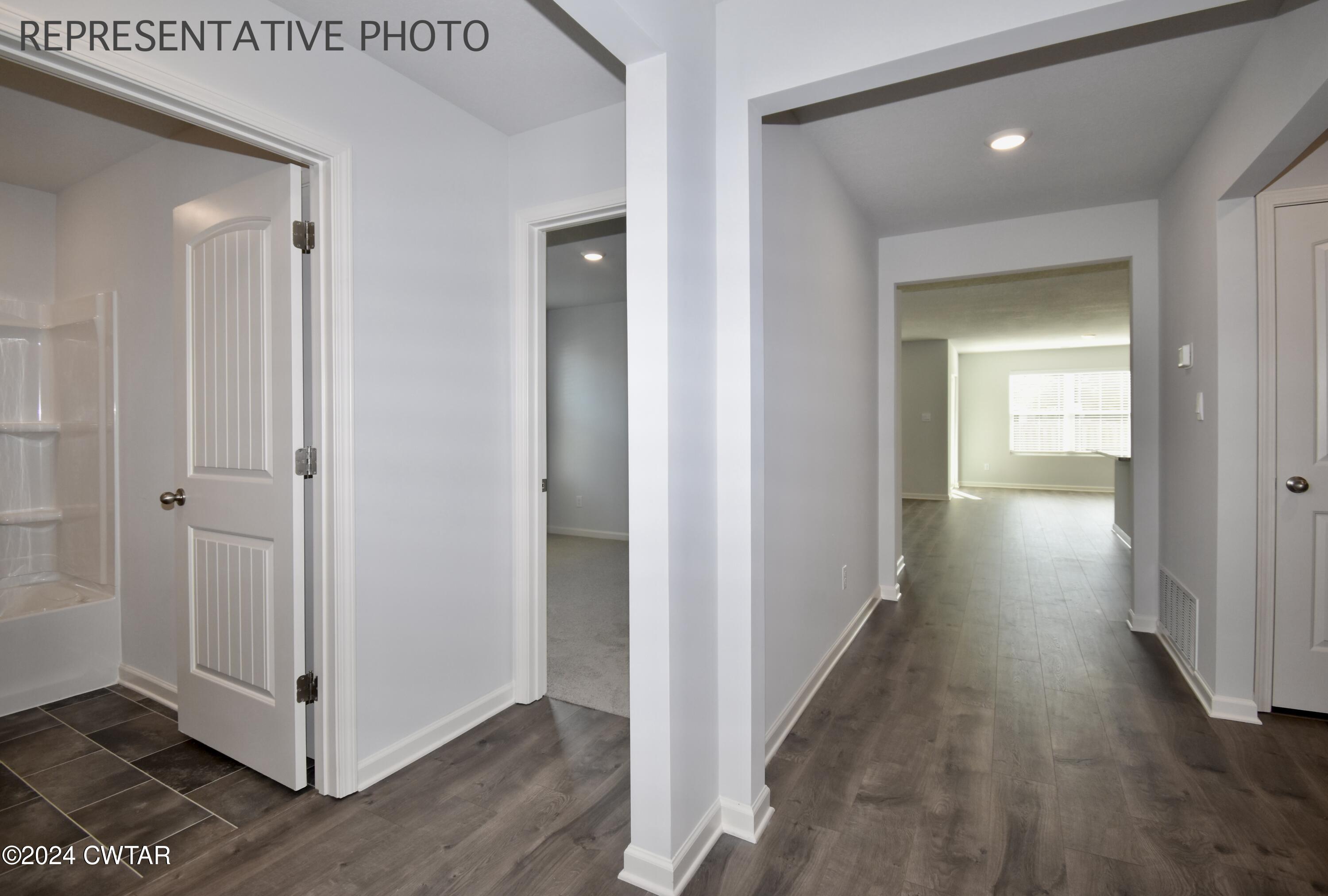 61 Vintage Grove Road Jackson, TN 38305 - Photo 2 of 25 a view of a hallway with wooden floor