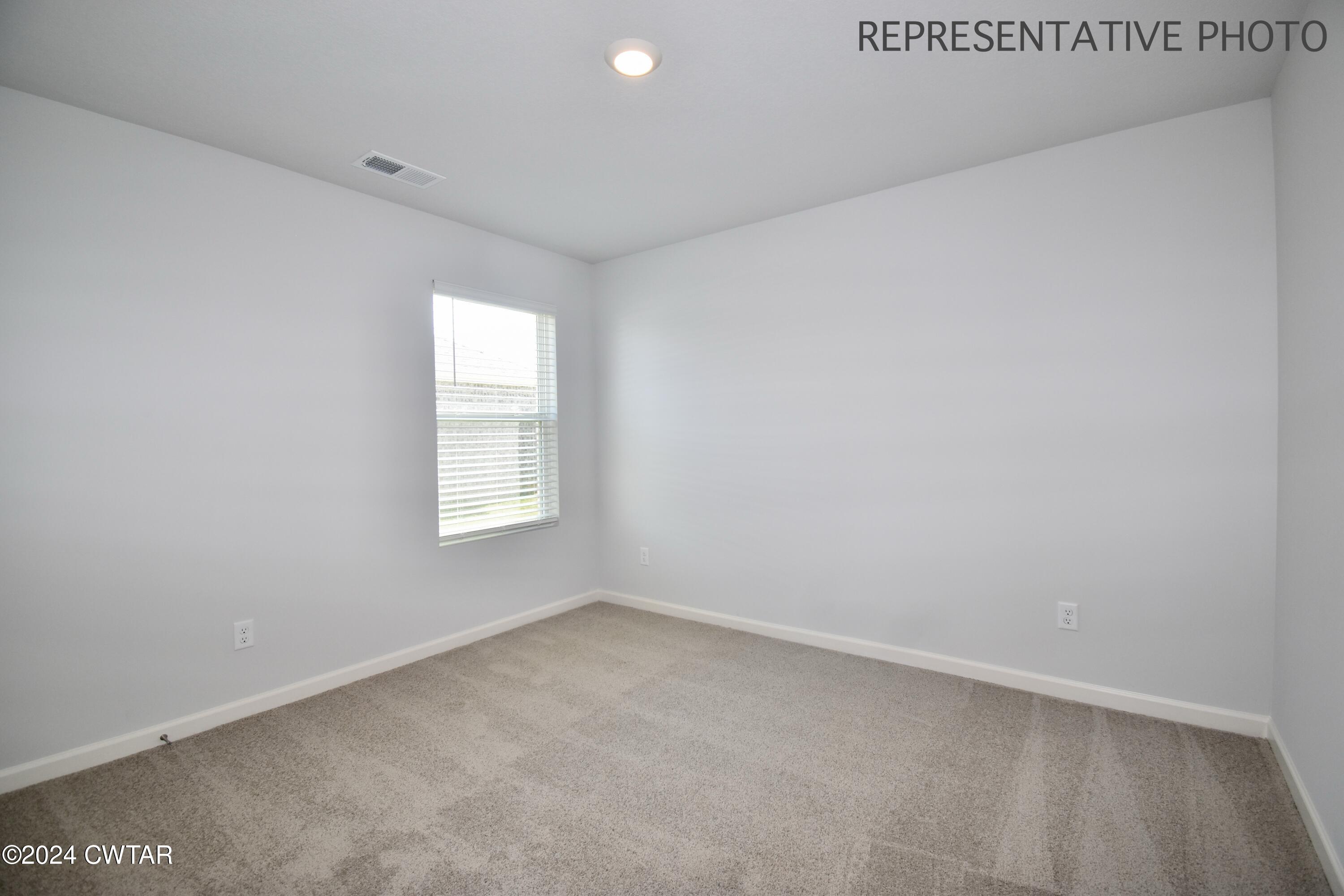 61 Vintage Grove Road Jackson, TN 38305 - Photo 23 of 25 an empty room with a window