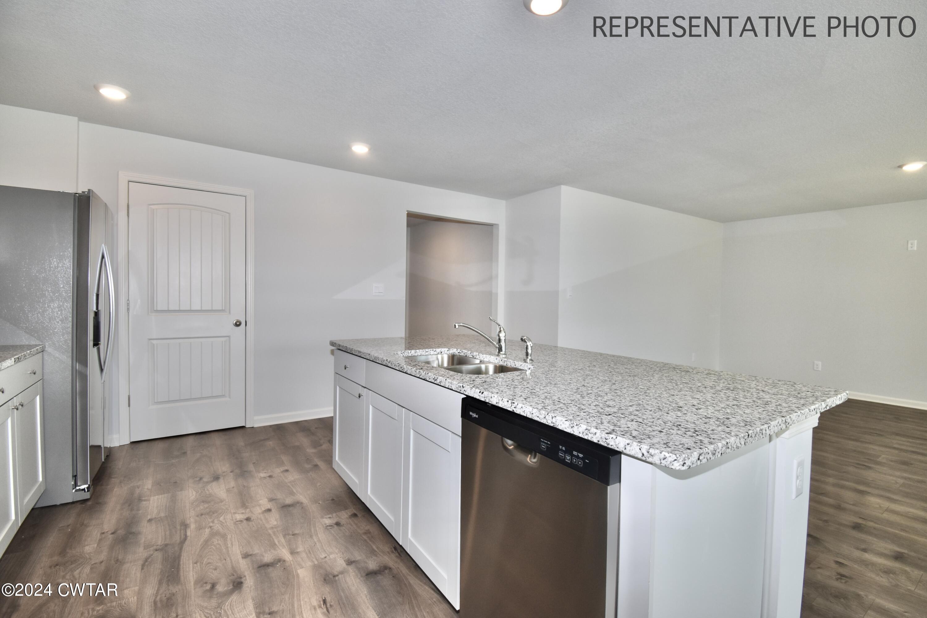 61 Vintage Grove Road Jackson, TN 38305 - Photo 7 of 25 a bathroom with a granite countertop sink and a mirror