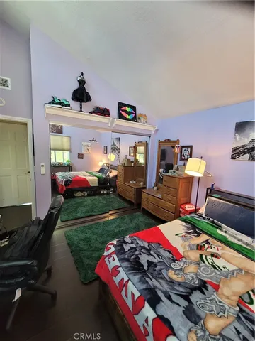 a bedroom with bed and a window